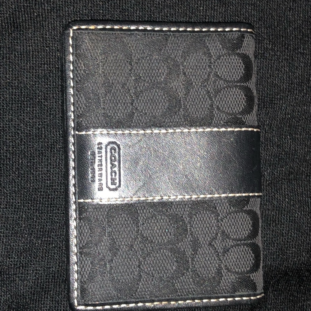 Coach black ID holder.